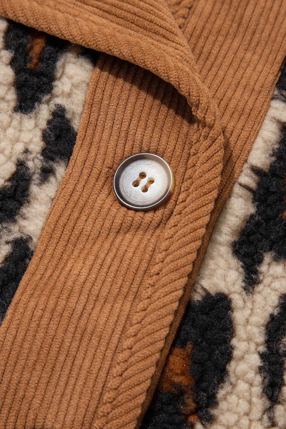 Leopard plush jacket with brown corduroy trim, button and corduroy trim close-up