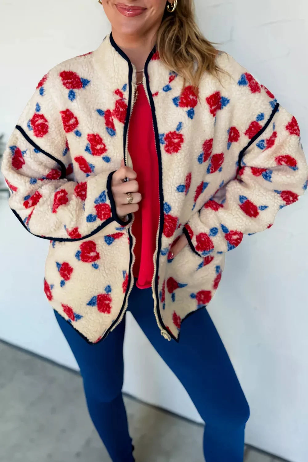 Cream with red flowers floral zip-up fleece jacket, front view open.