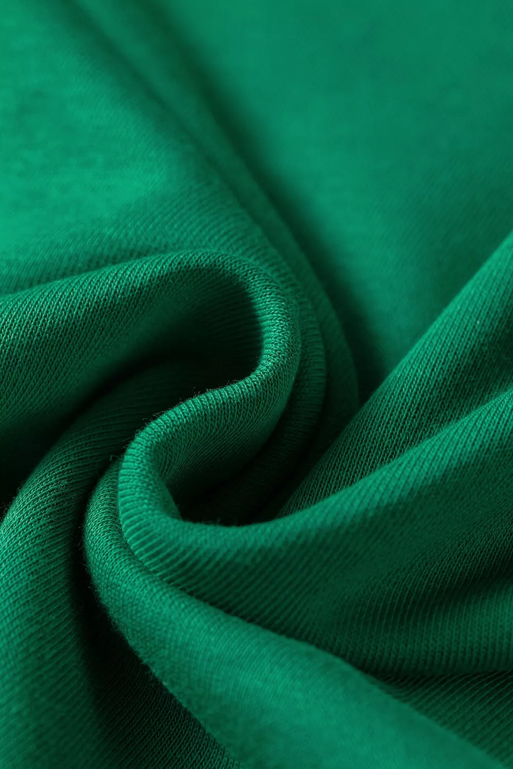 Green hooded top and wide-leg pants set, fabric close-up