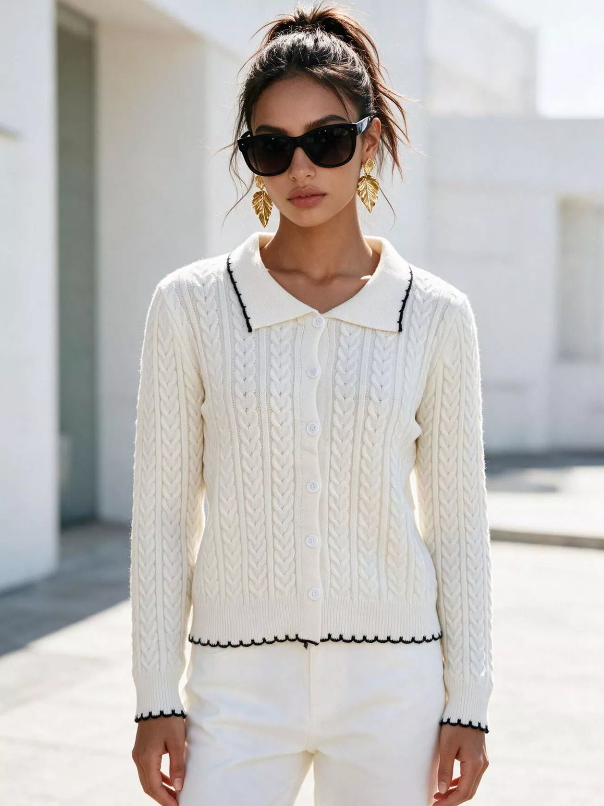 Ivory cable-knit polo-collar cardigan, standing front view.