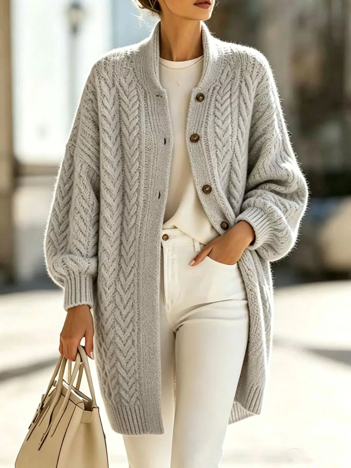 Light gray longline cable-knit button-front cardigan, front view.