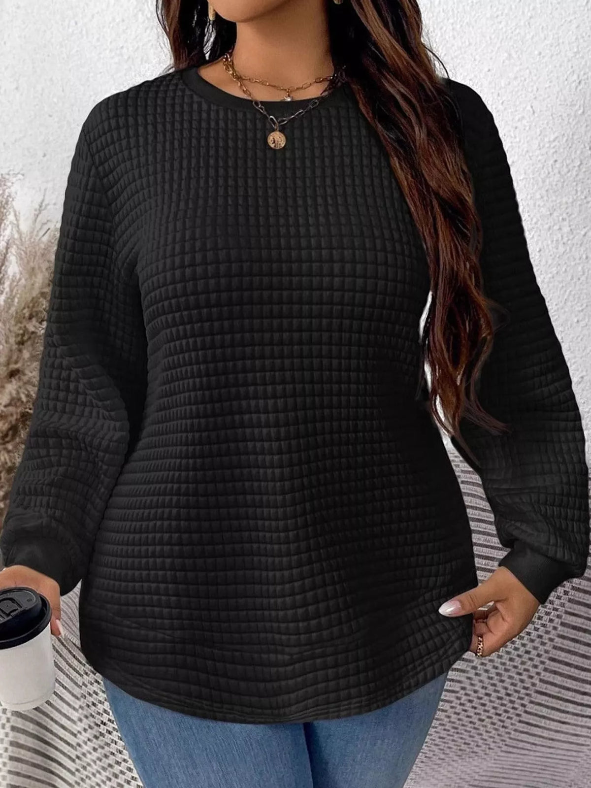 Black waffle knit sweatshirt with curved hem