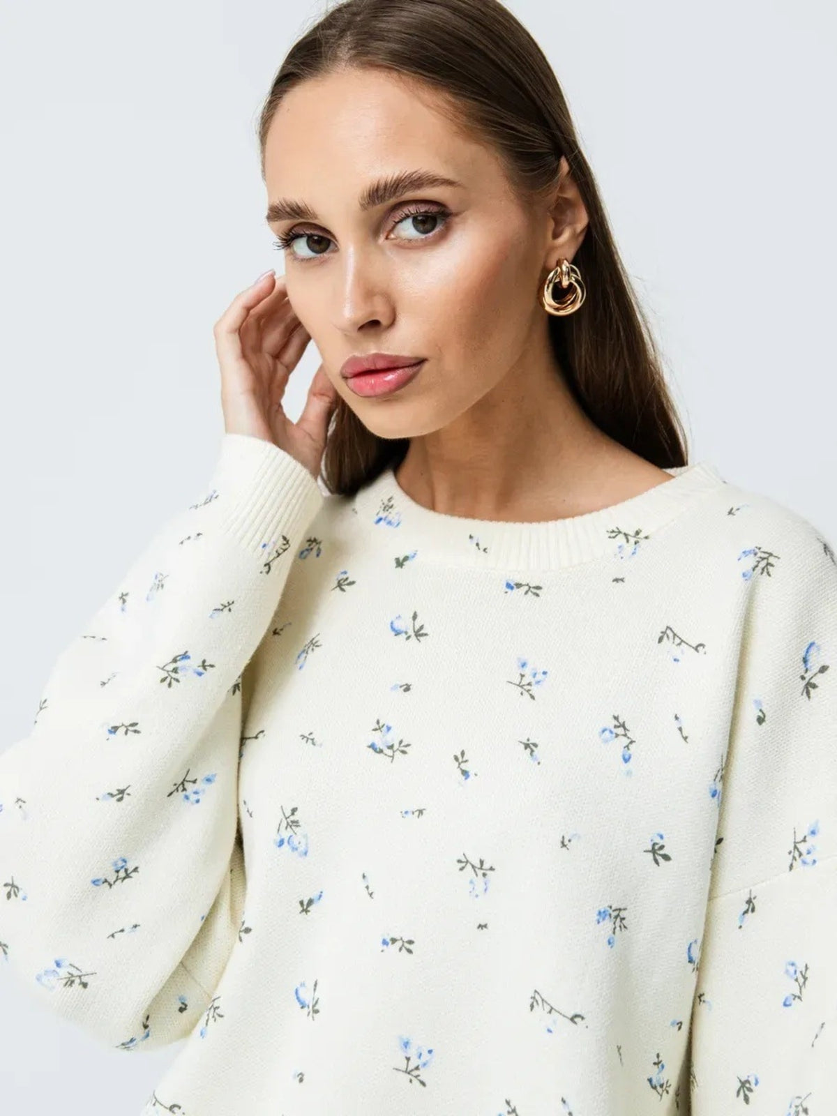 White floral dropped-shoulder oversized sweater, front portrait view.