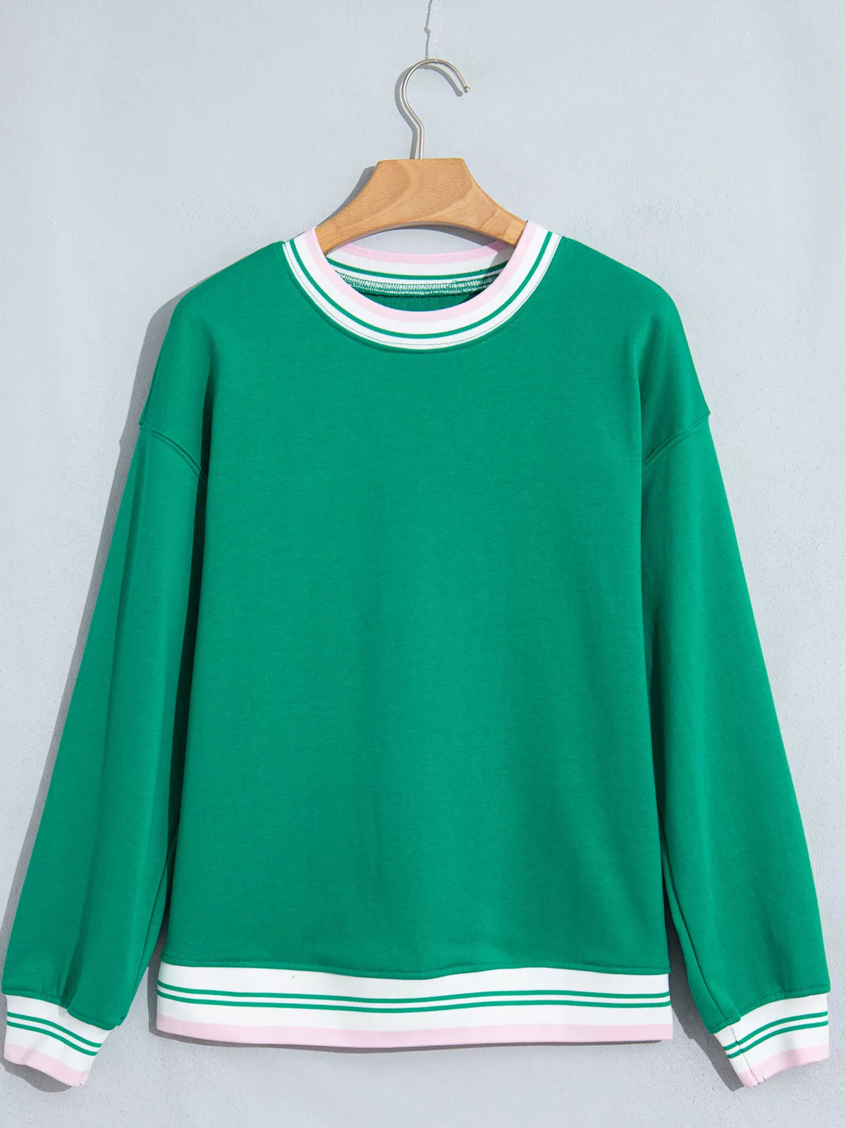 Green sweatshirt with contrast striped ribbed trim, front view