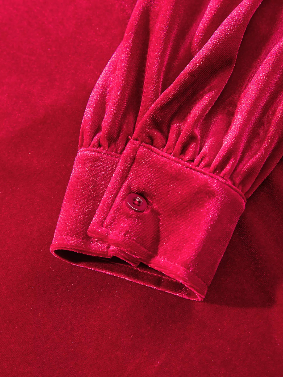 Button cuff on red velvet button-down shirt with patch pockets
