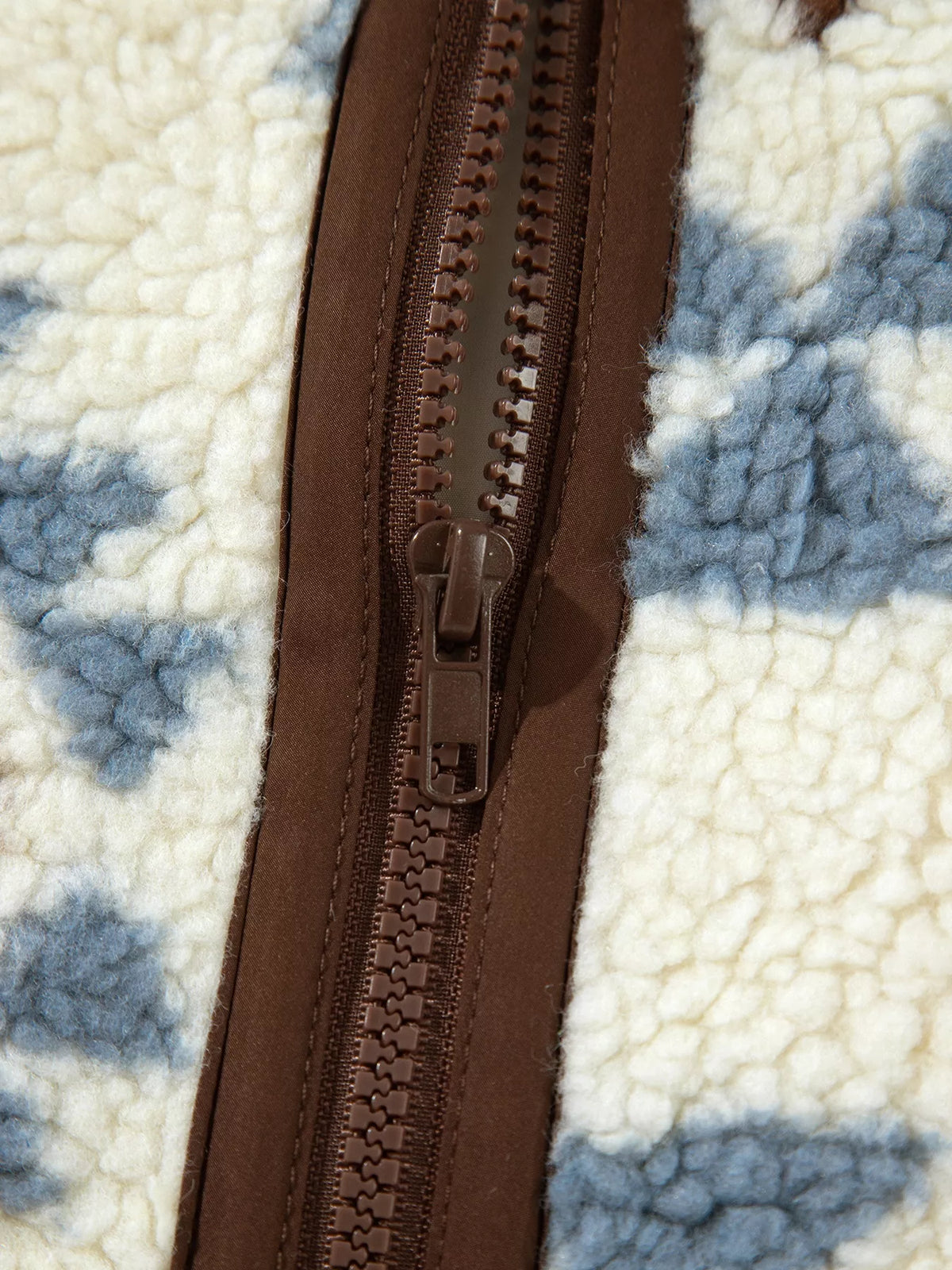 Cream blue and brown geometric print sherpa sweatshirt, zipper detail
