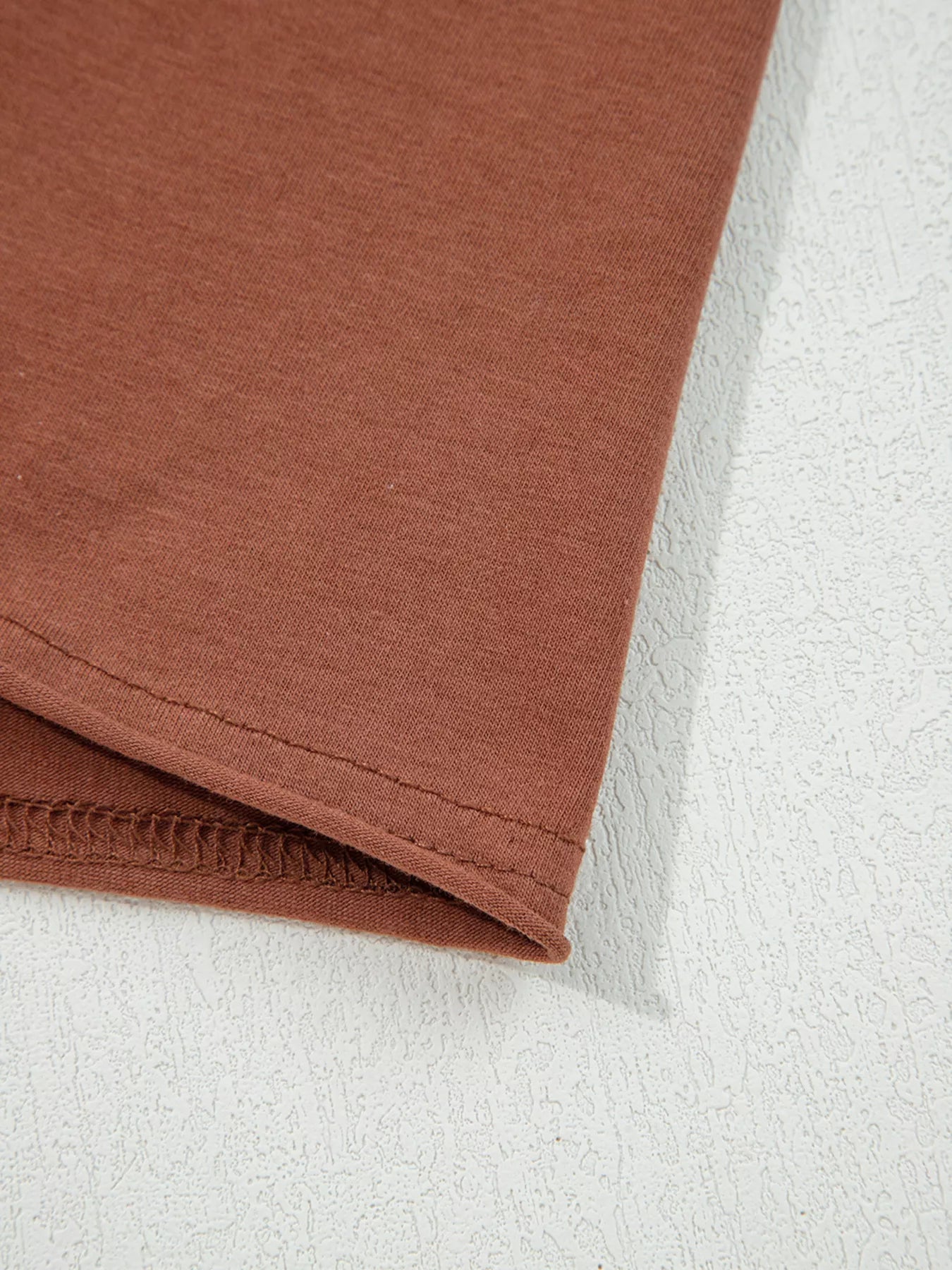 Trendsi Raw Seam Detail Solid Color Long Sleeve Top -
