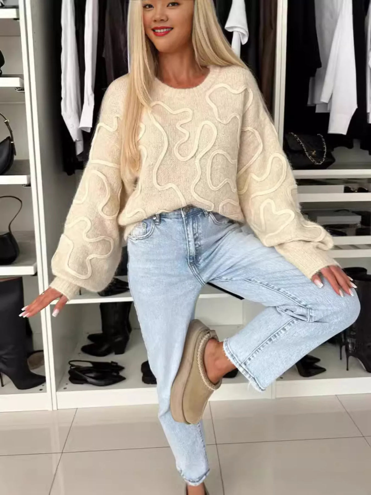 Beige abstract pattern oversized crewneck sweater, full front view.