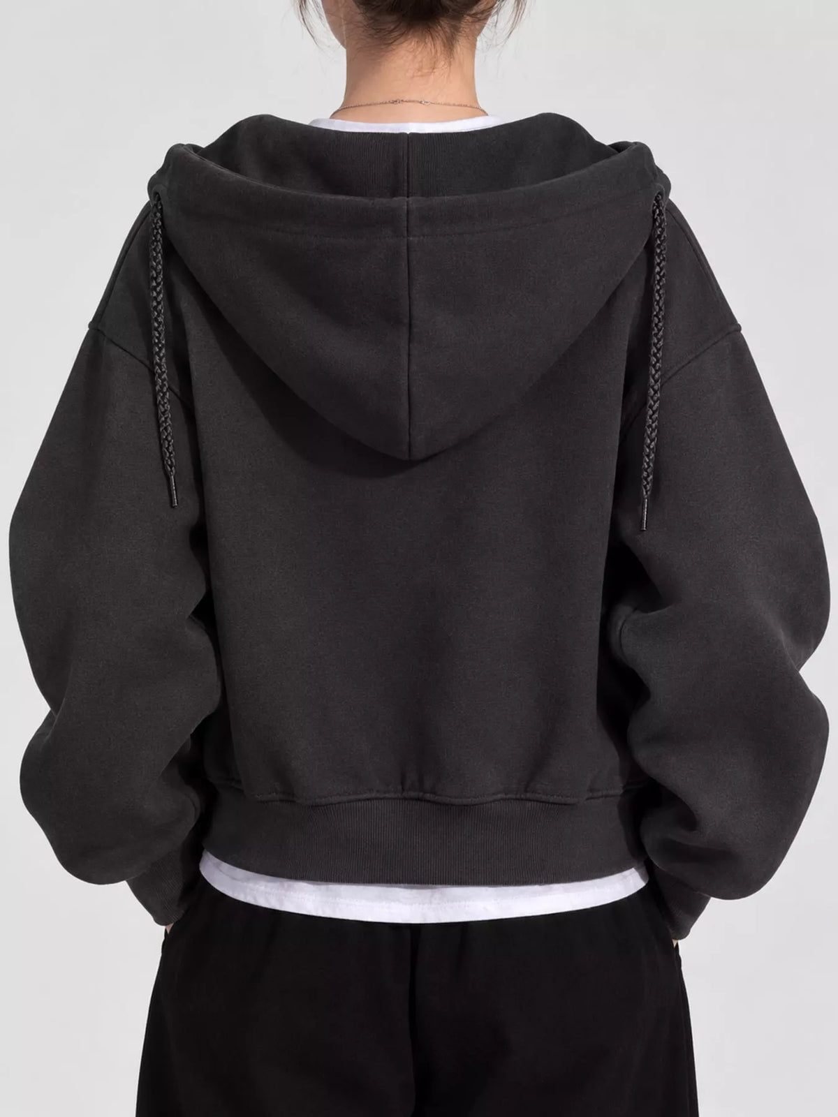 Black oversized zip-up cropped hoodie, back view