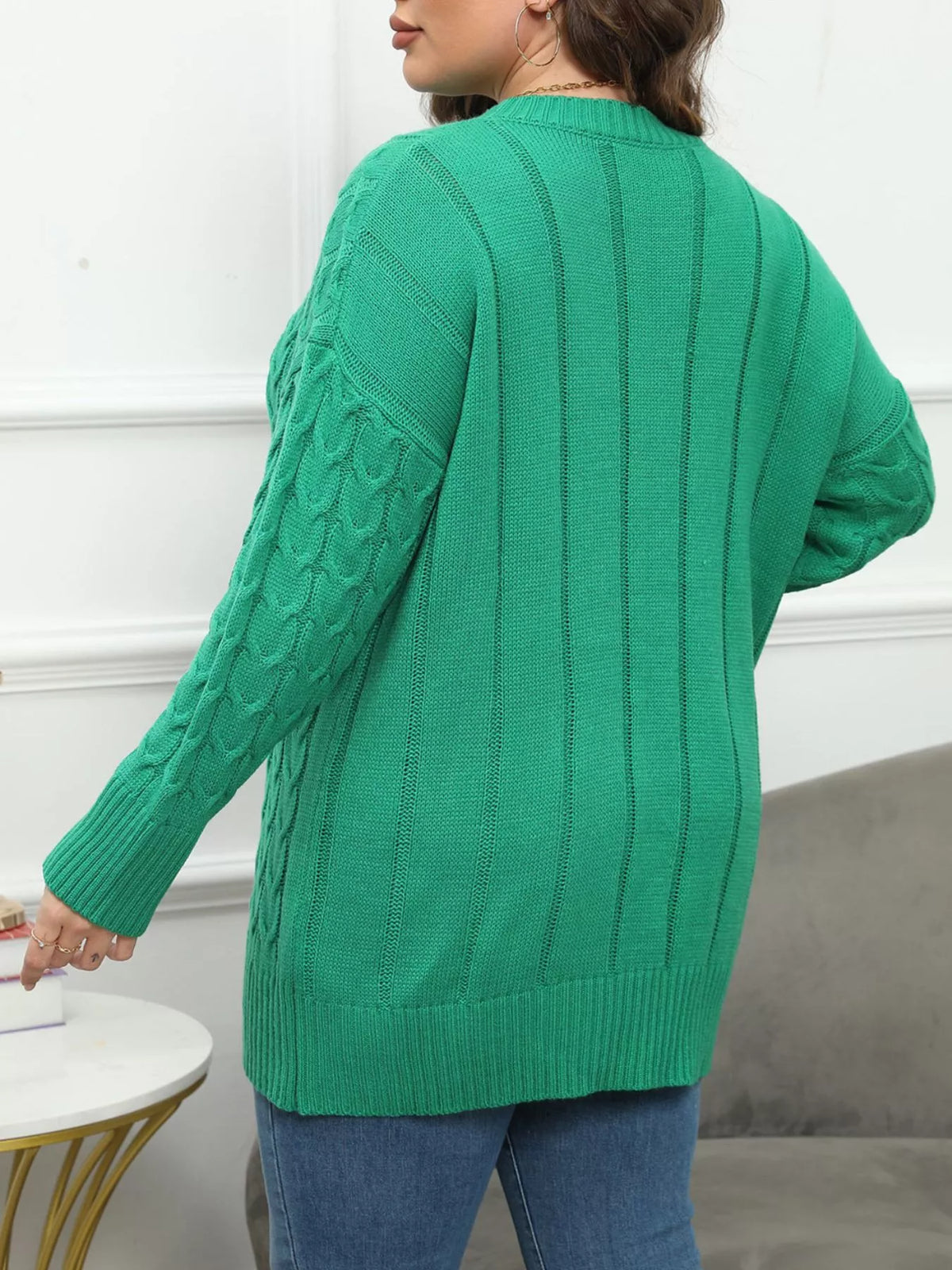 Green plus-size cable-knit sweater, back view
