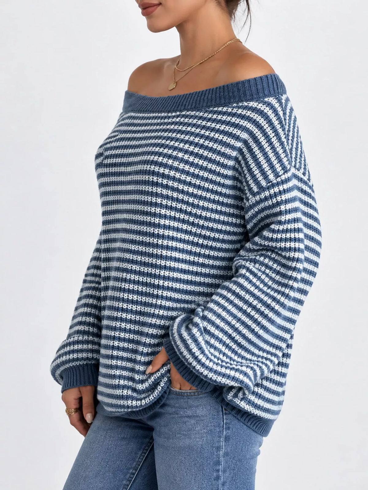 Blue and white striped knit boat neck sweater, side view