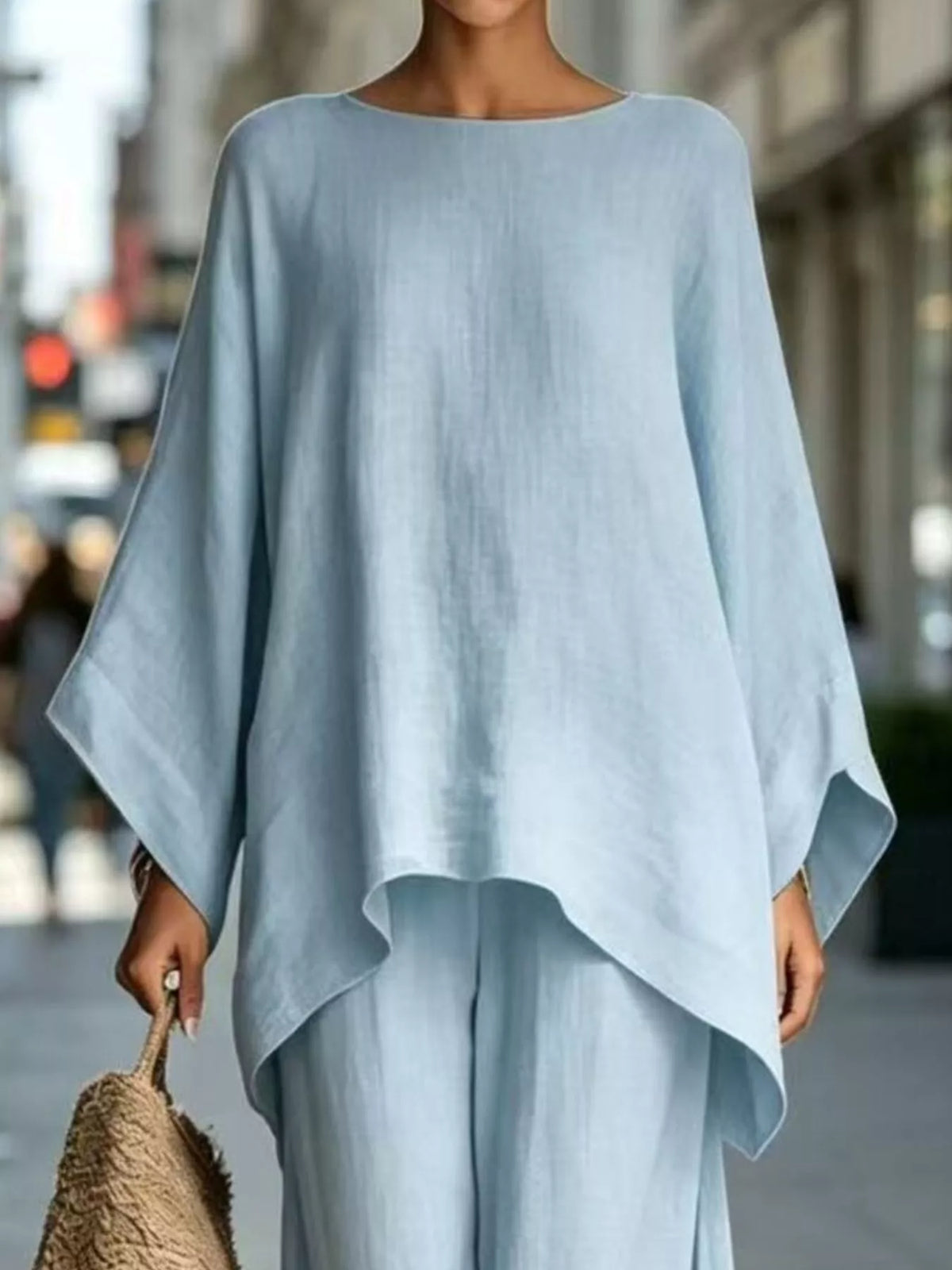 Light blue batwing top, neckline and hem view