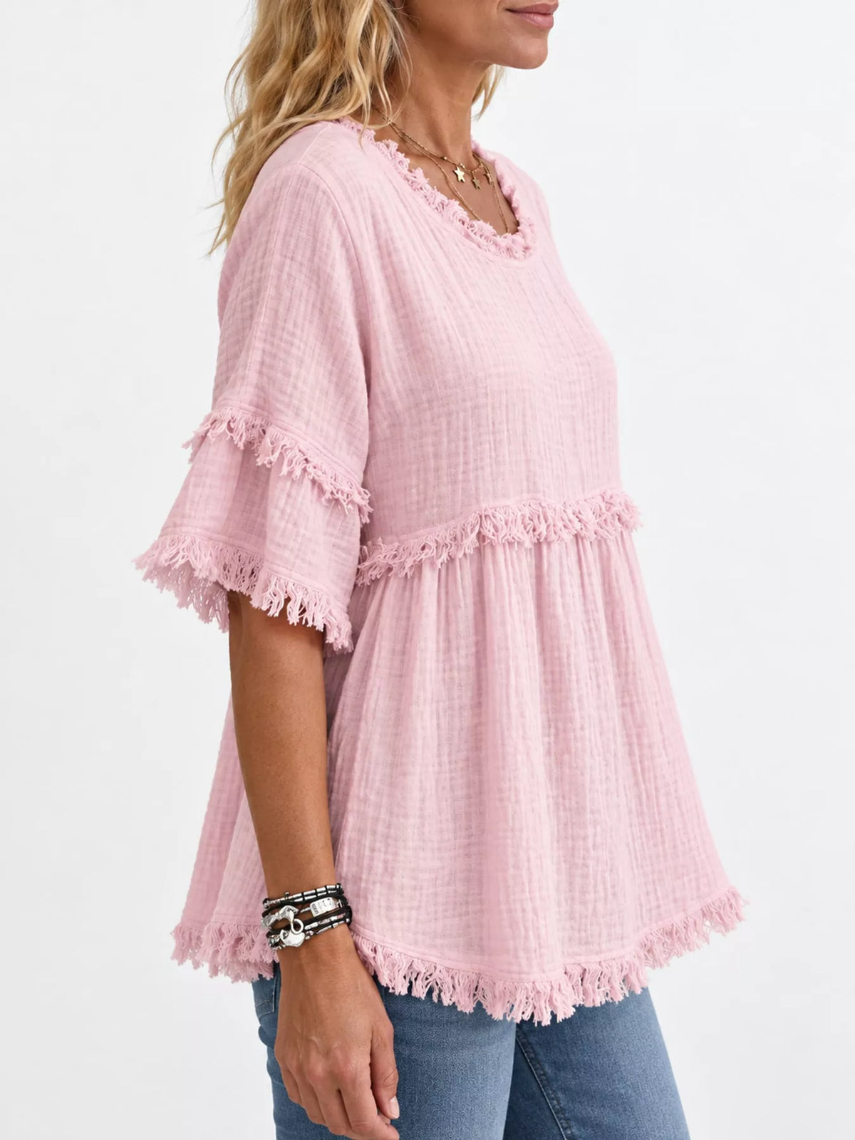 Pink frayed edge textured blouse, side view