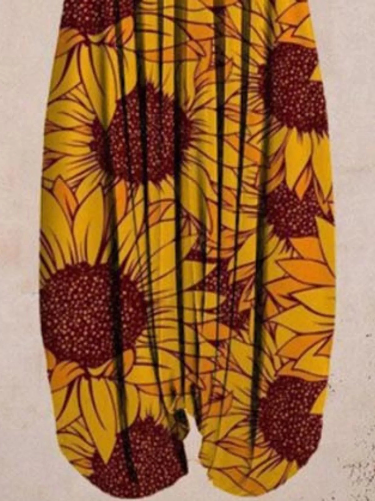 Yellow sunflower-print V-neck sleeveless jumpsuit, leg and print detail