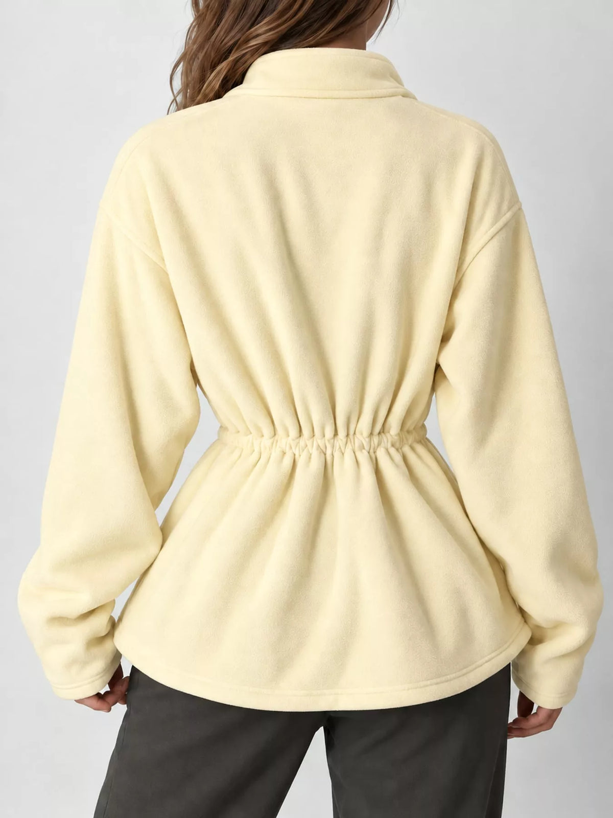 Yellow drawstring fleece zip-up jacket, back view