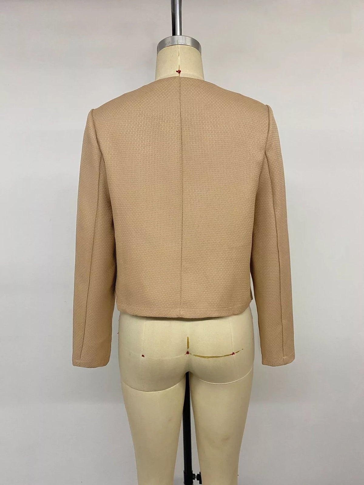 Tan textured cropped jacket with gold-tone buttons, back on mannequin