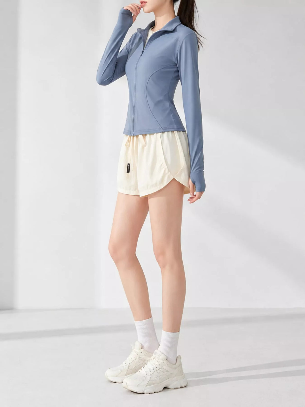 Blue quick-dry zip-up jacket, side view