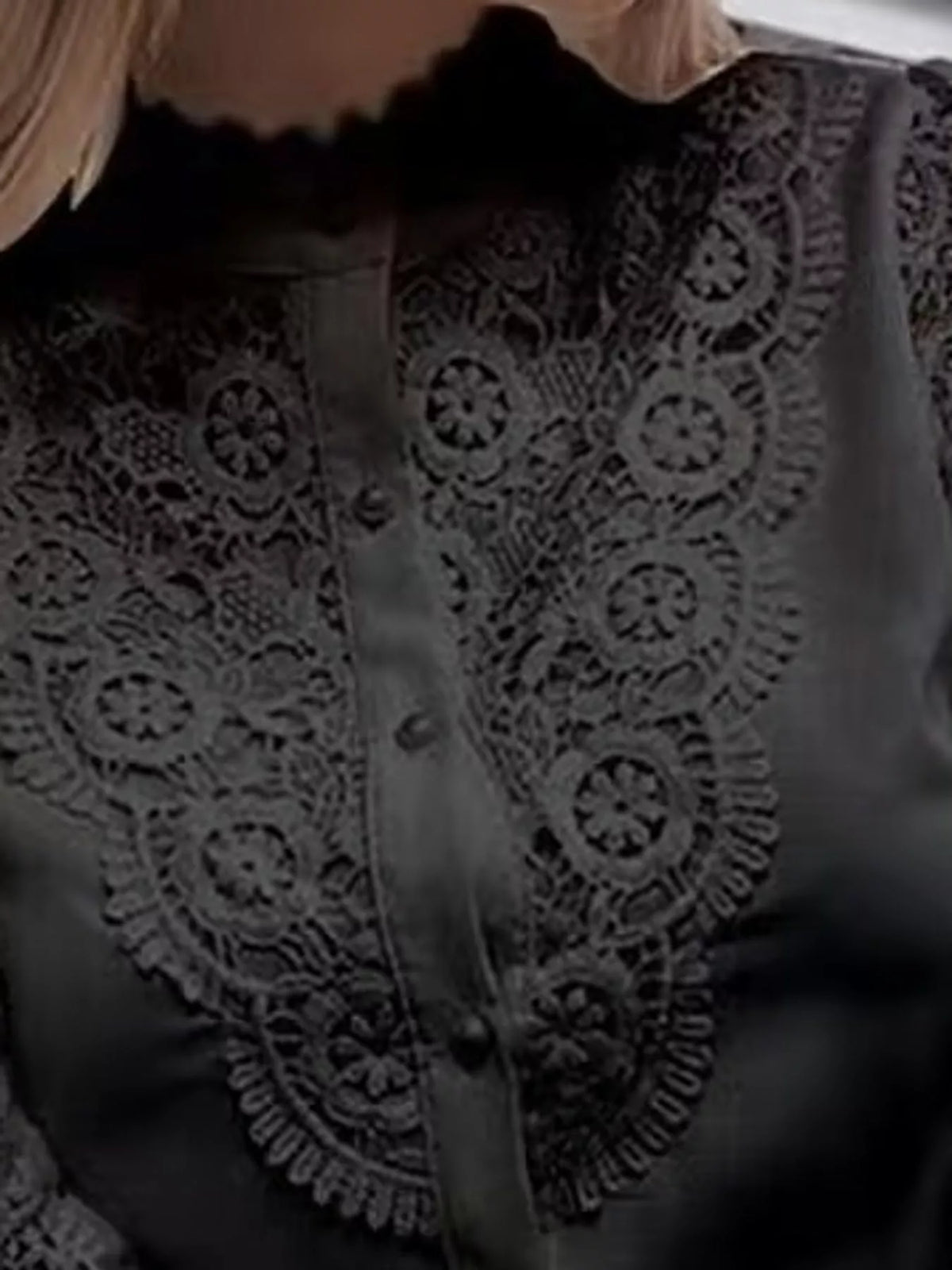 Lace bib and button detail on black shirt