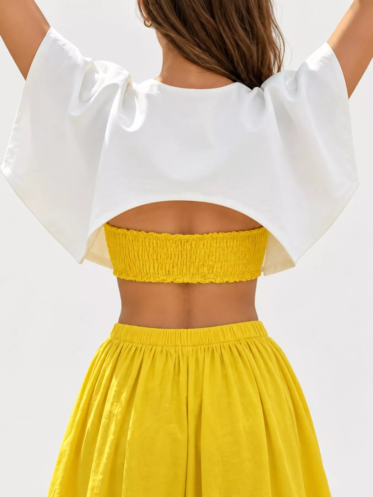 White single button closure cropped cape, back view