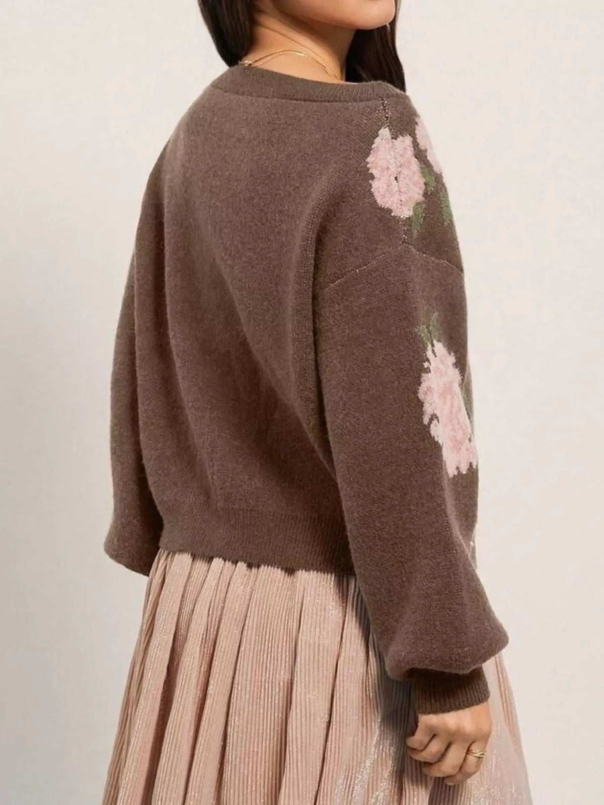 Brown floral pattern sweater, back view