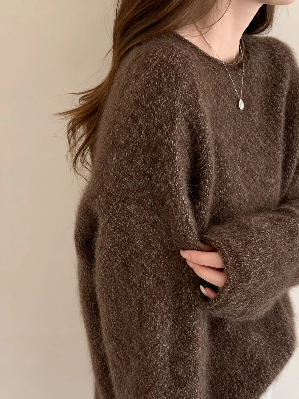 Round neck long sleeve sweater, side view