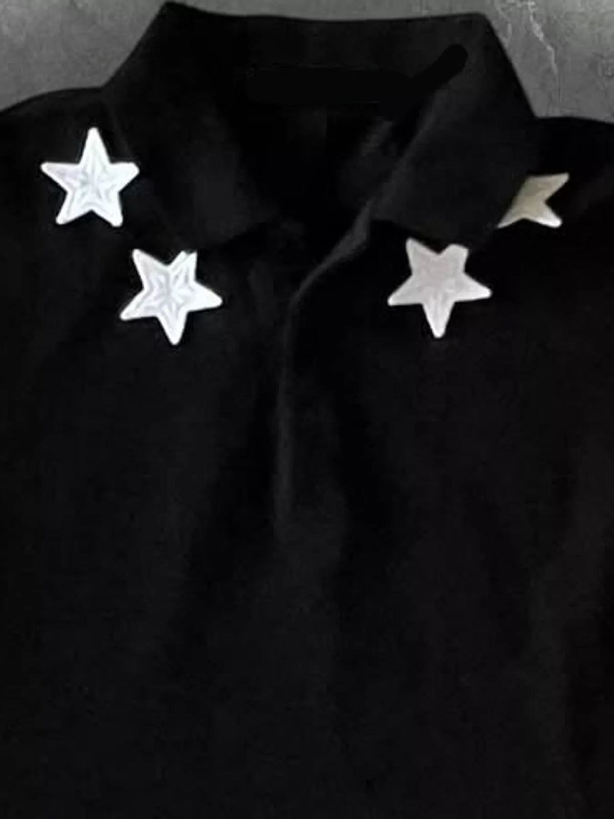 Black star-embellished polo t-shirt