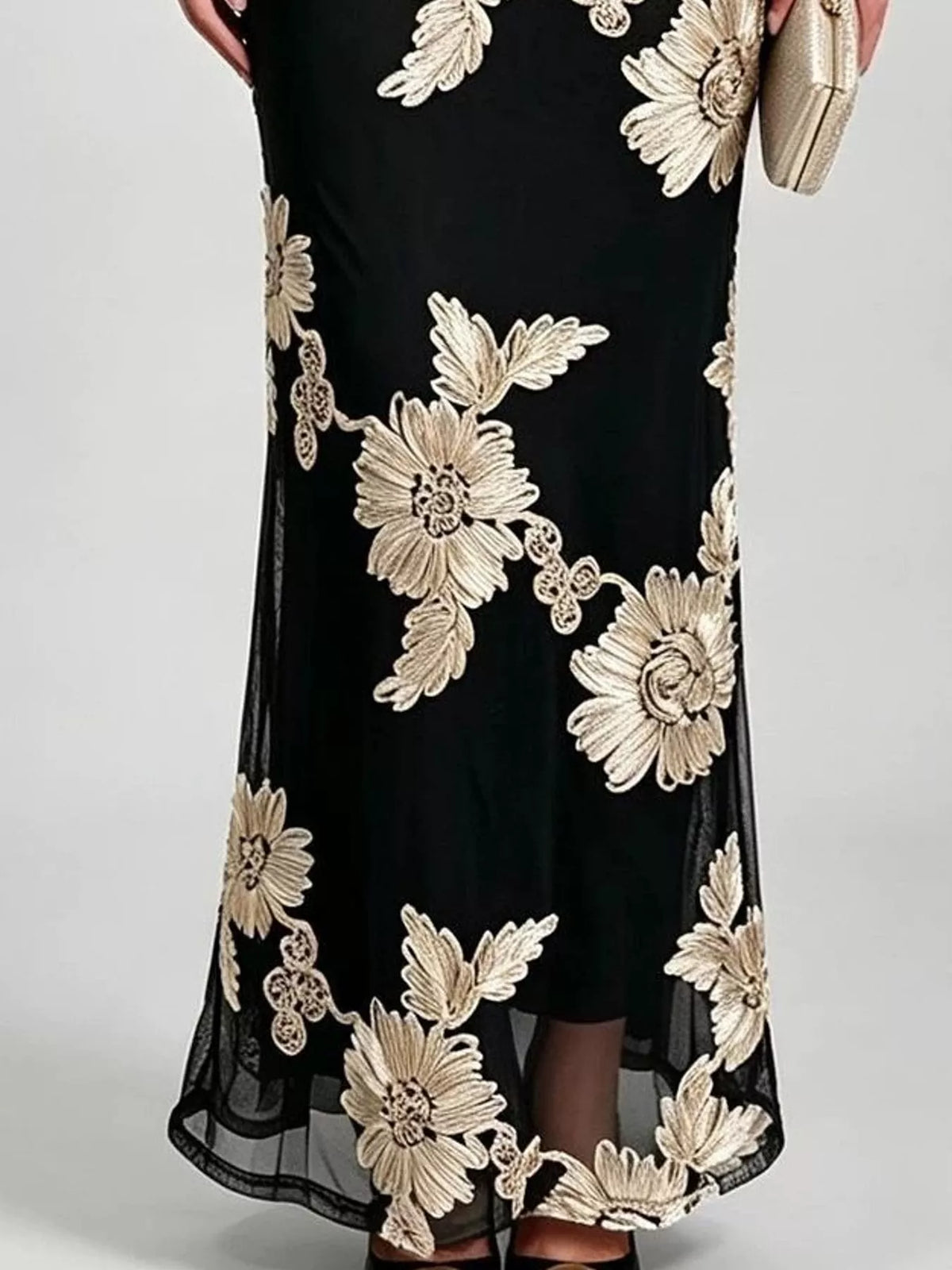 Black floral one-shoulder maxi dress, sheer hem detail
