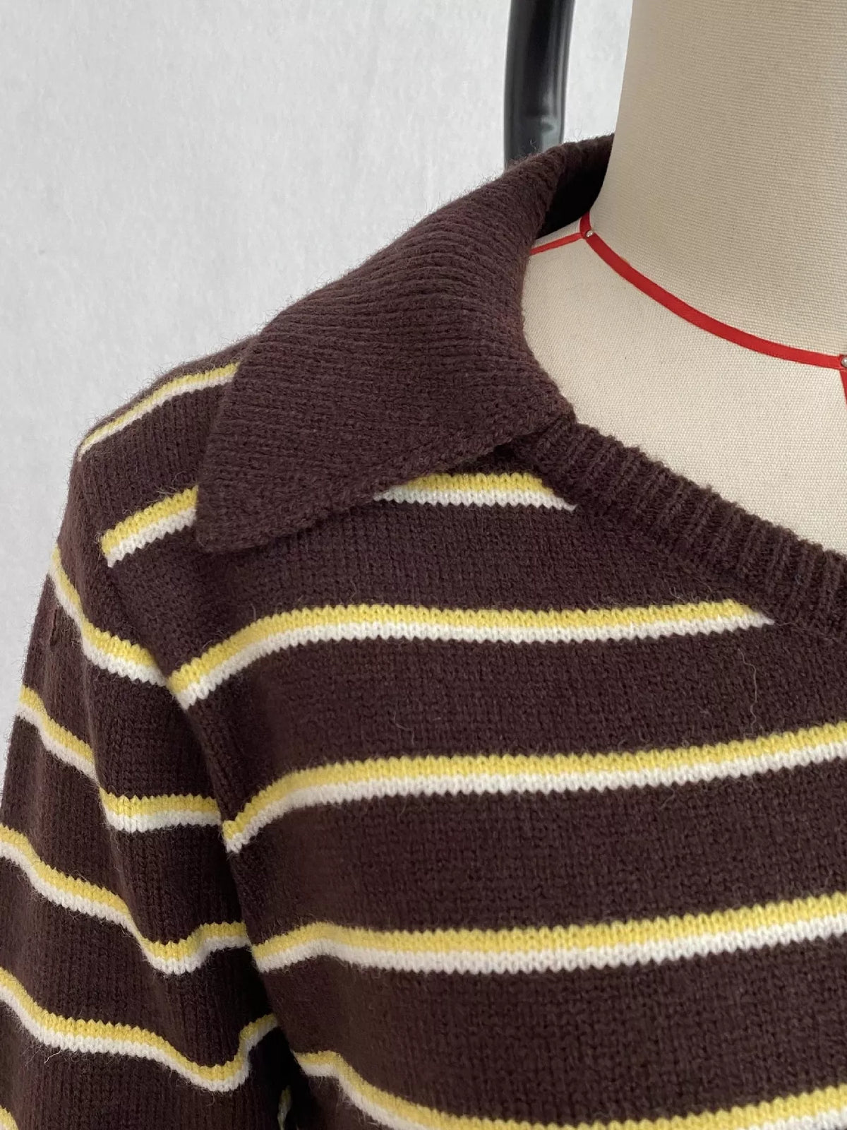 Brown and cream striped polo-collar sweater, polo collar detail.