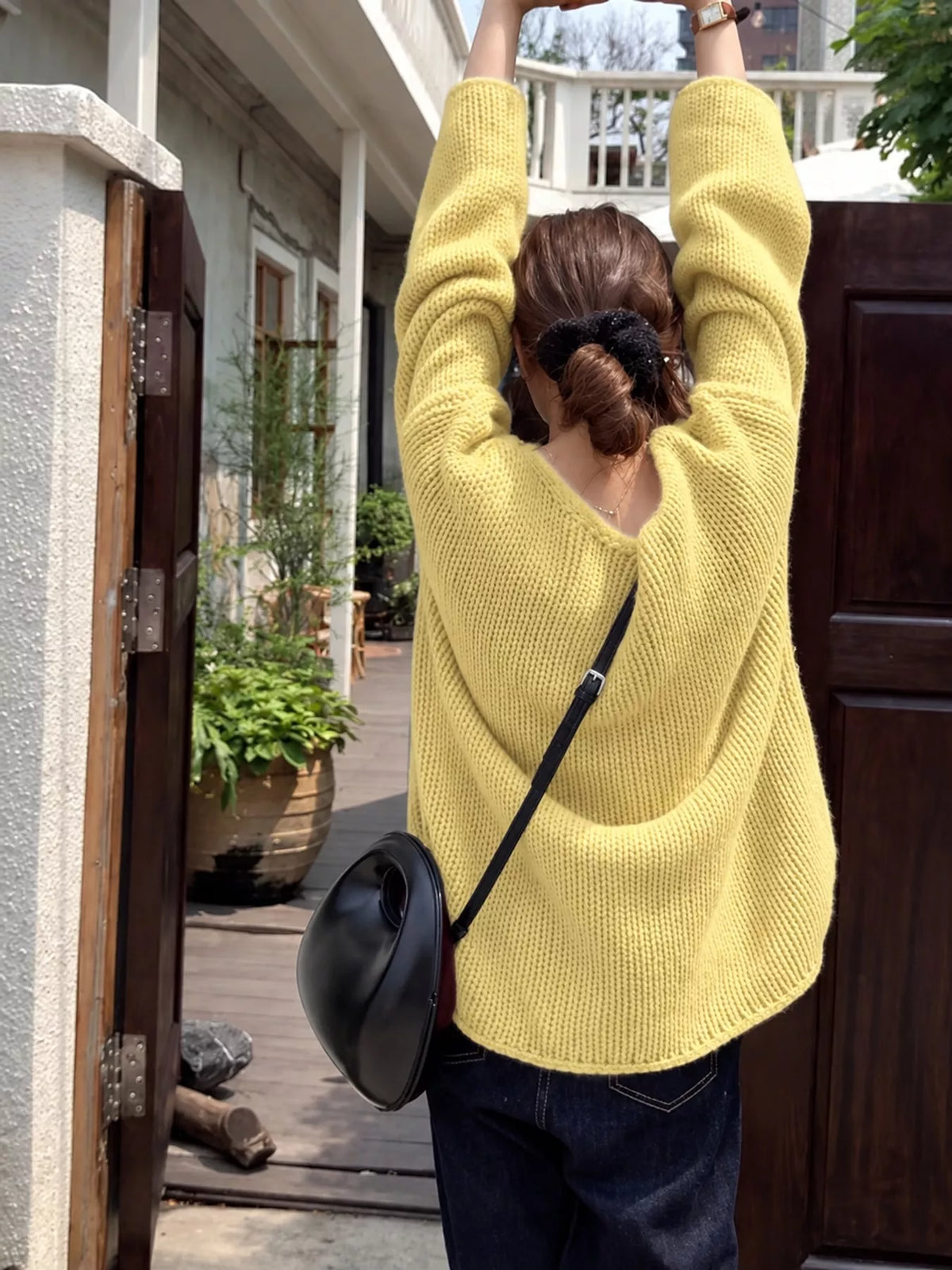 Warm yellow long-sleeve sweater, back view