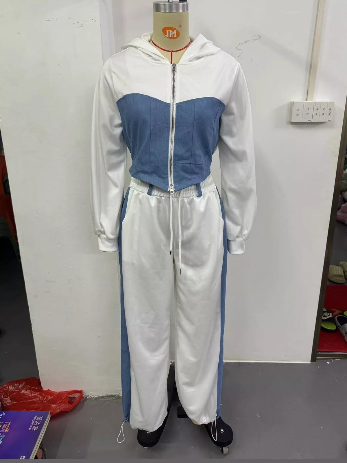 White and light blue color-block zip-up hoodie and wide-leg pants set — front view