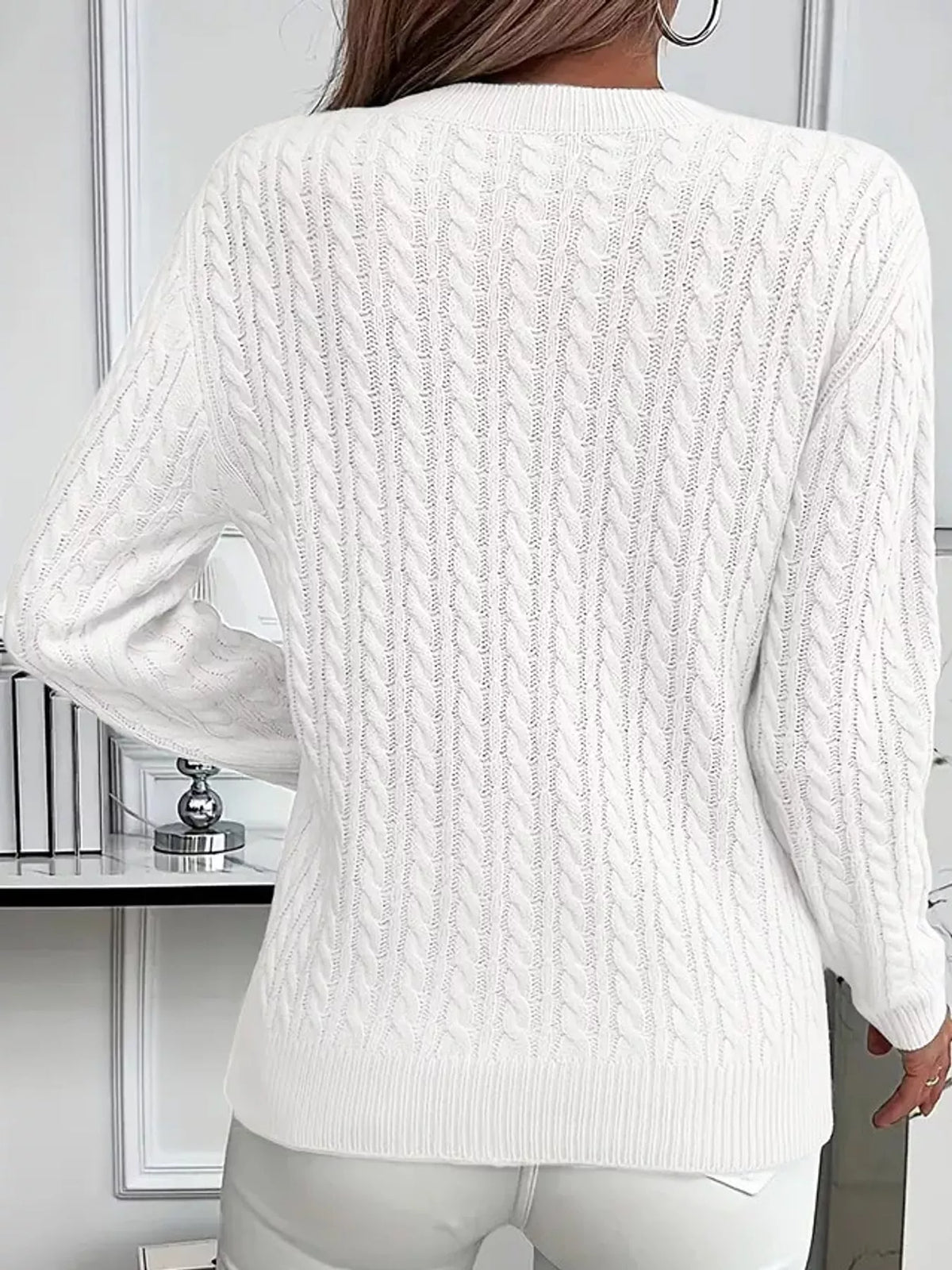 White cable knit round neck sweater, back view