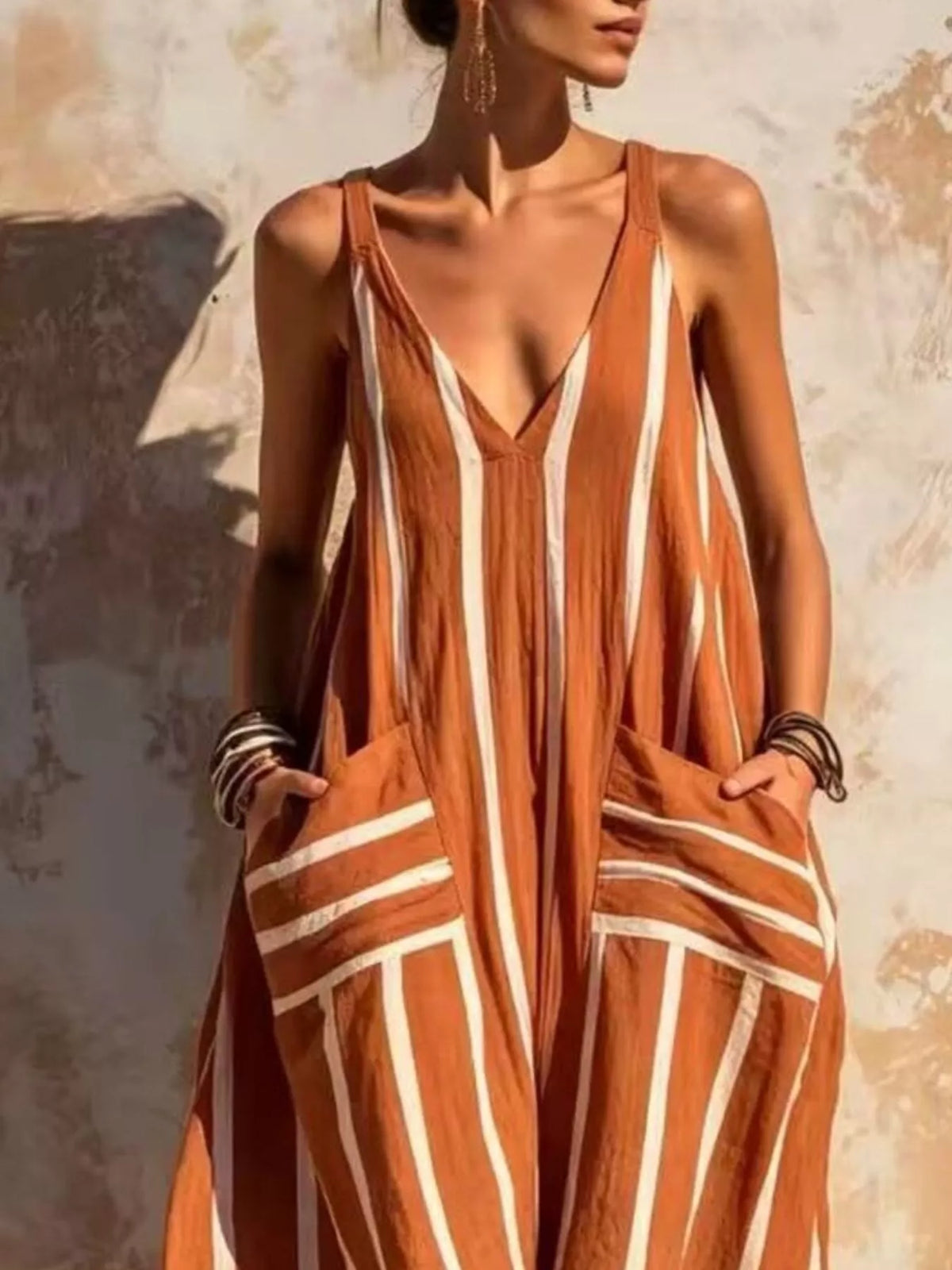 Orange and white striped sleeveless jumpsuit, neckline and pockets detail