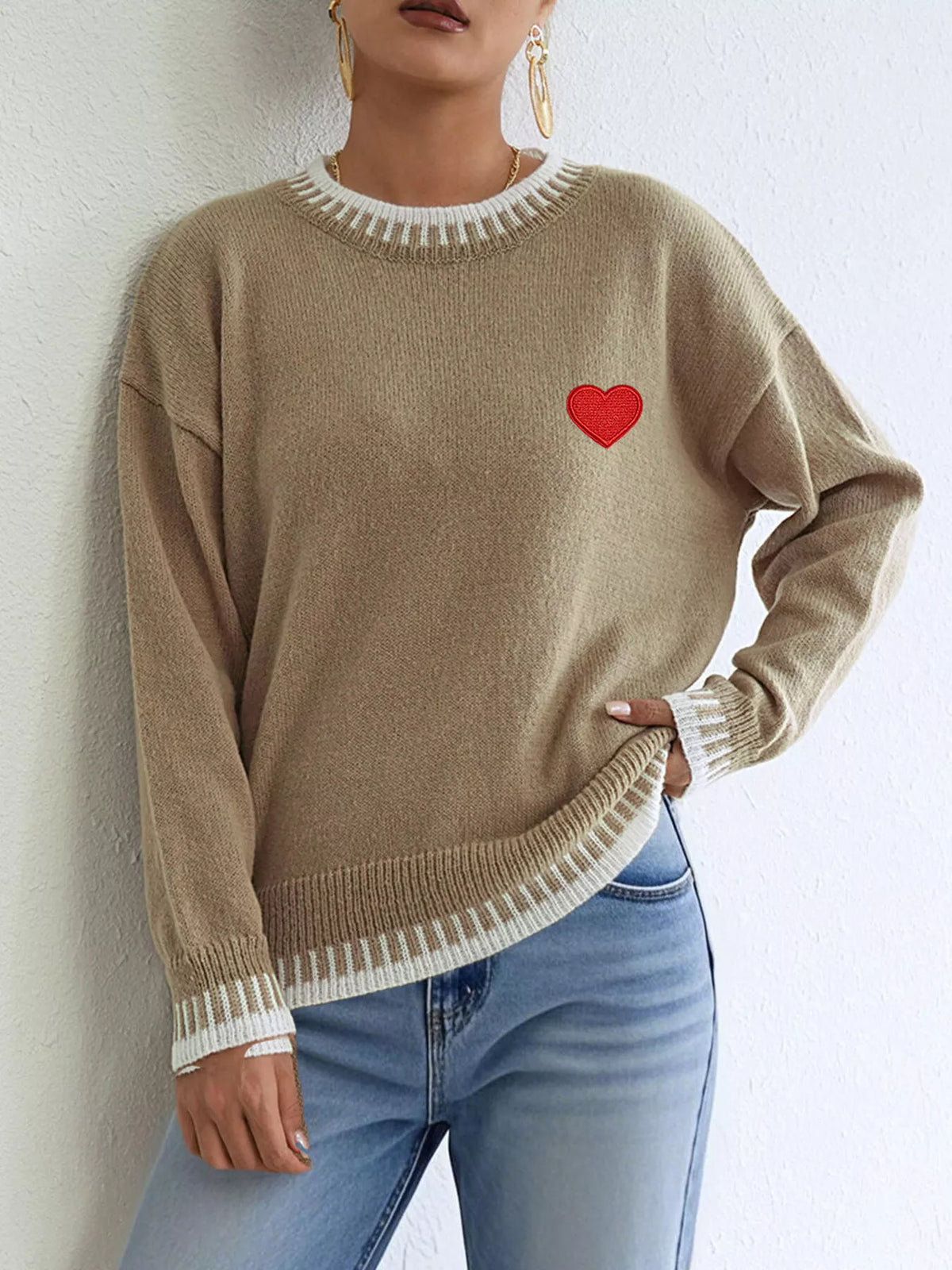 Heart-embroidered contrast-trim sweater in camel, angled front view
