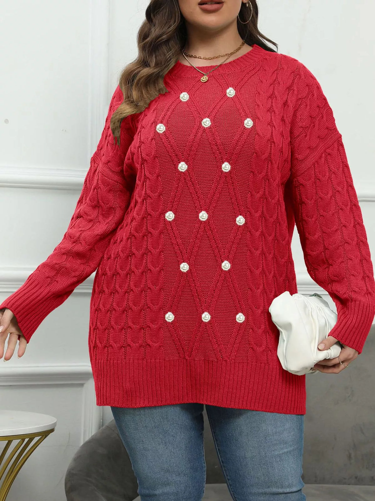 Red plus-size cable-knit sweater with pearl-like front accents, relaxed front view