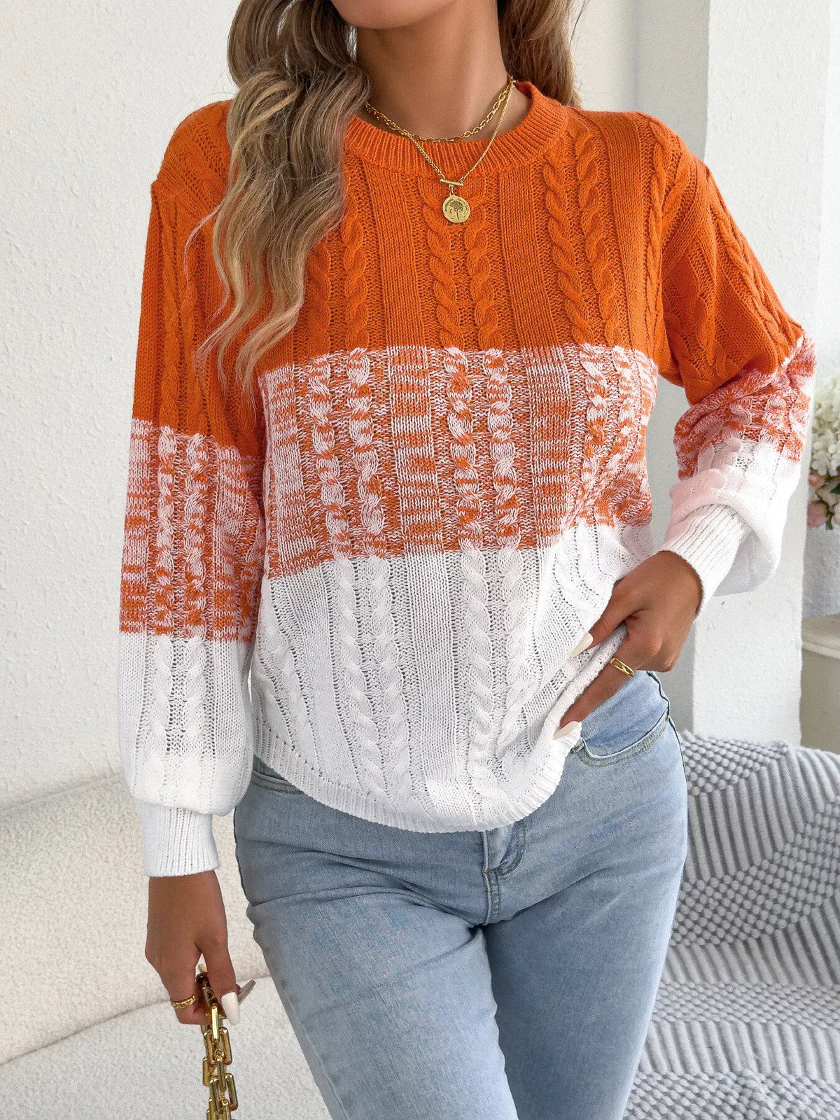Orange colorblock cable knit round neck sweater