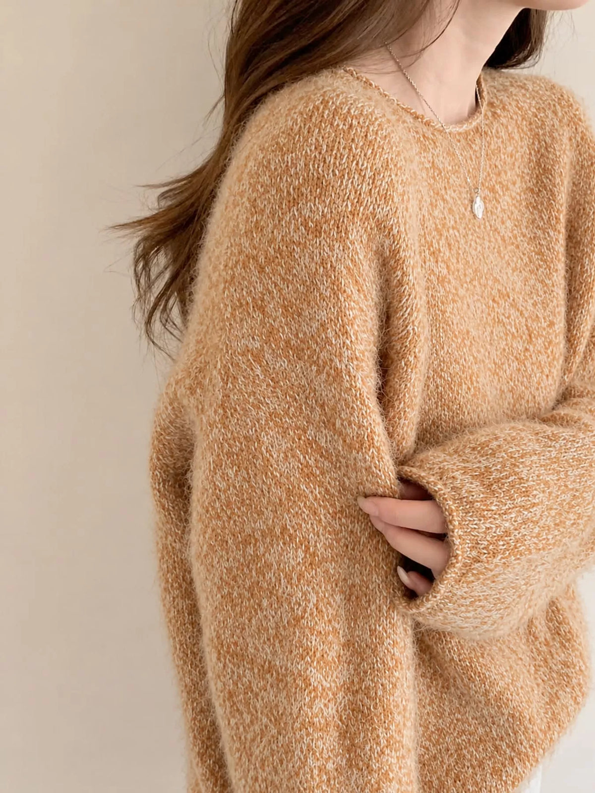 Round neck long sleeve sweater, side view