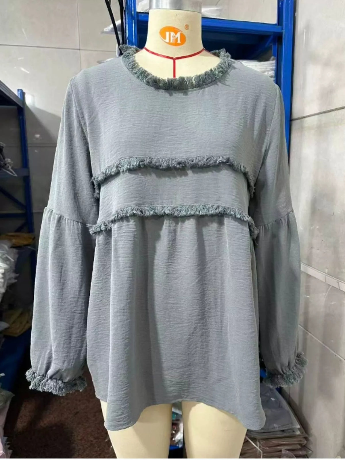 Gray textured frayed-trim peplum blouse