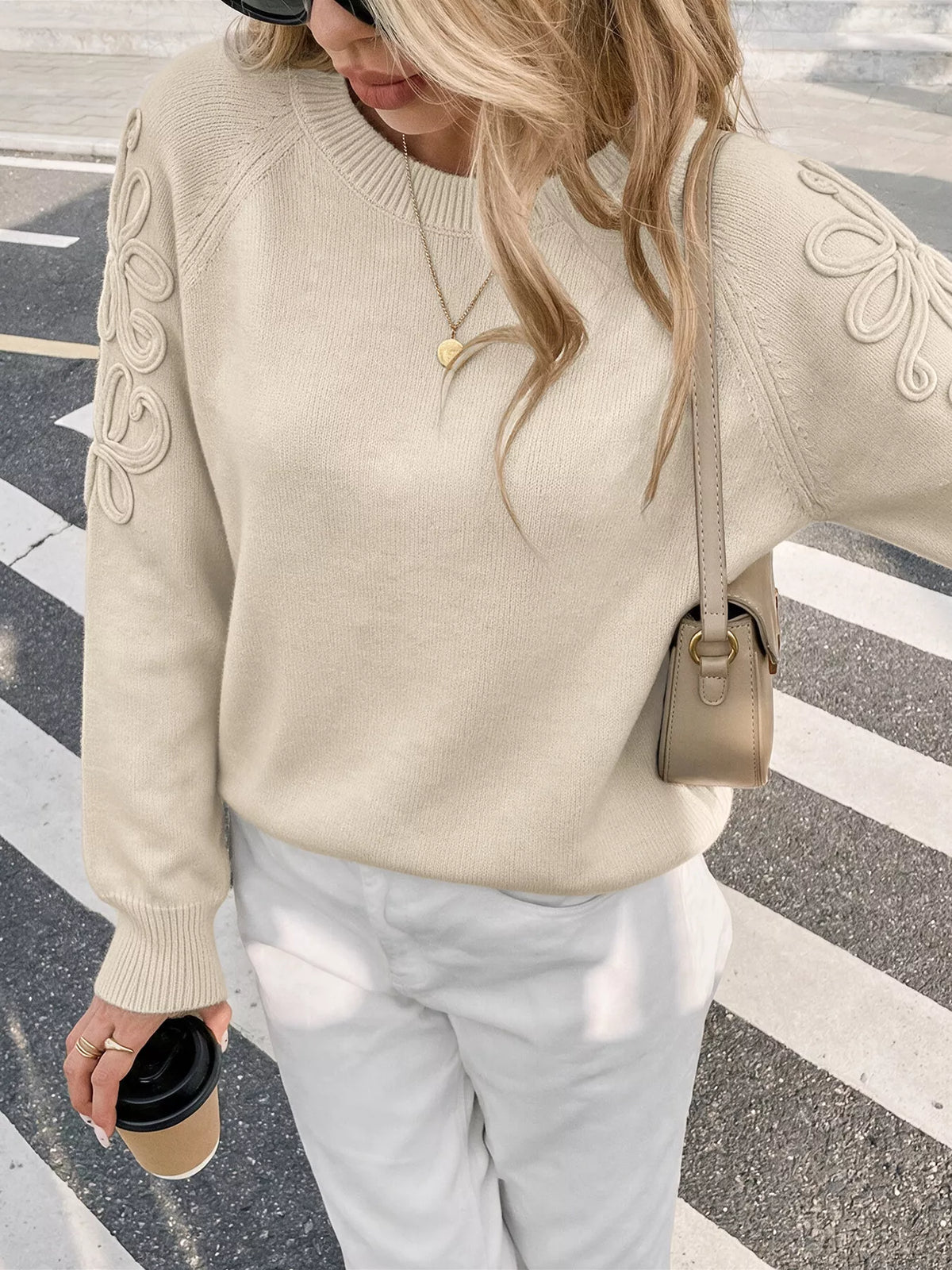 Cream floral raglan sleeve sweater, neckline and sleeve detail