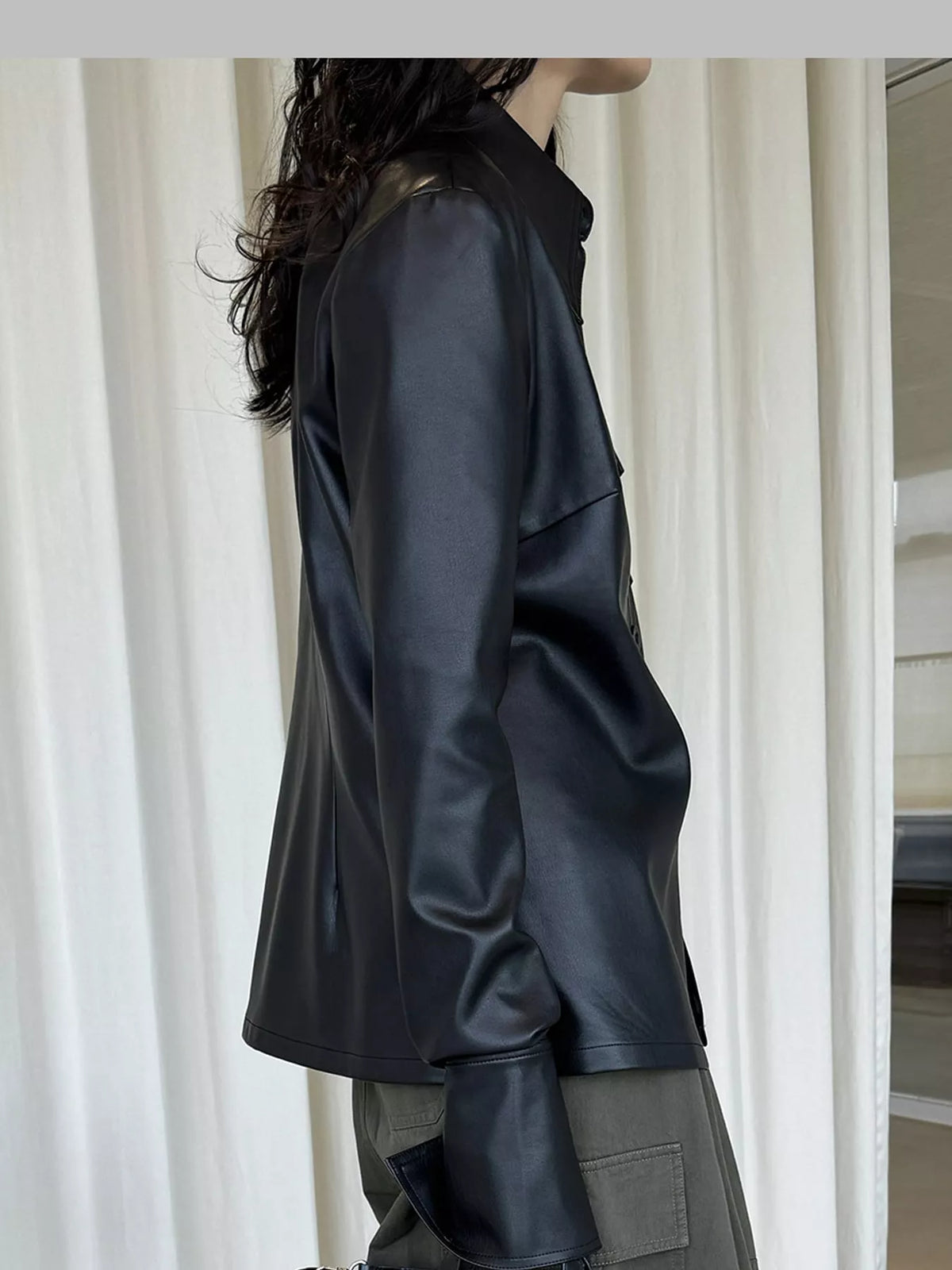 Black faux leather button-front jacket — side view