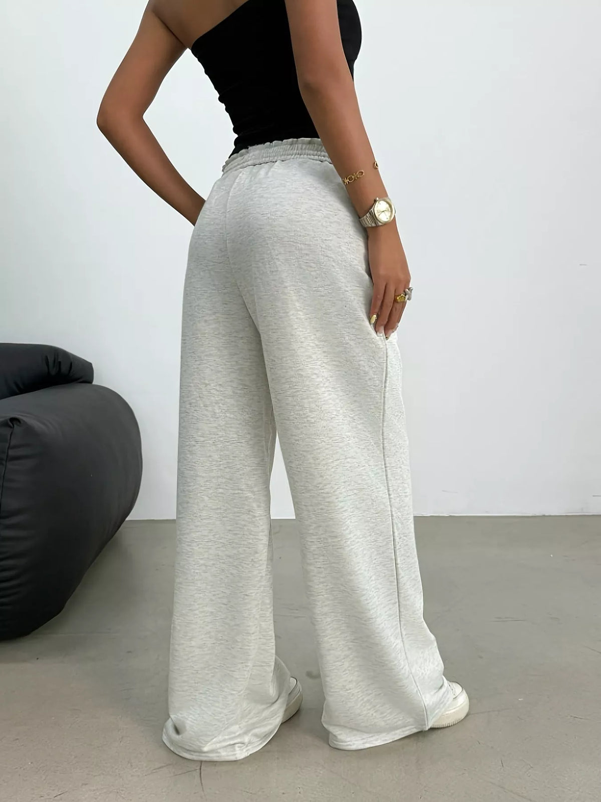 Cream drawstring loose fit pants, back view