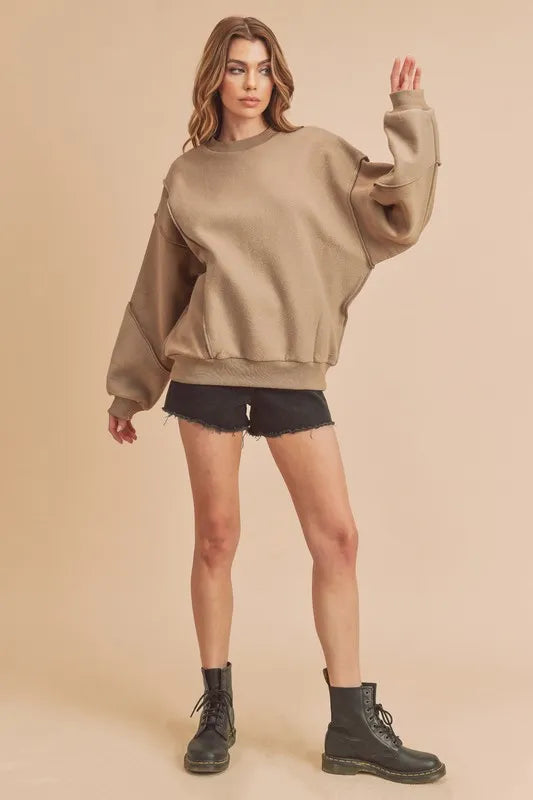 Exposed-seam round-neck drop-shoulder sweatshirt