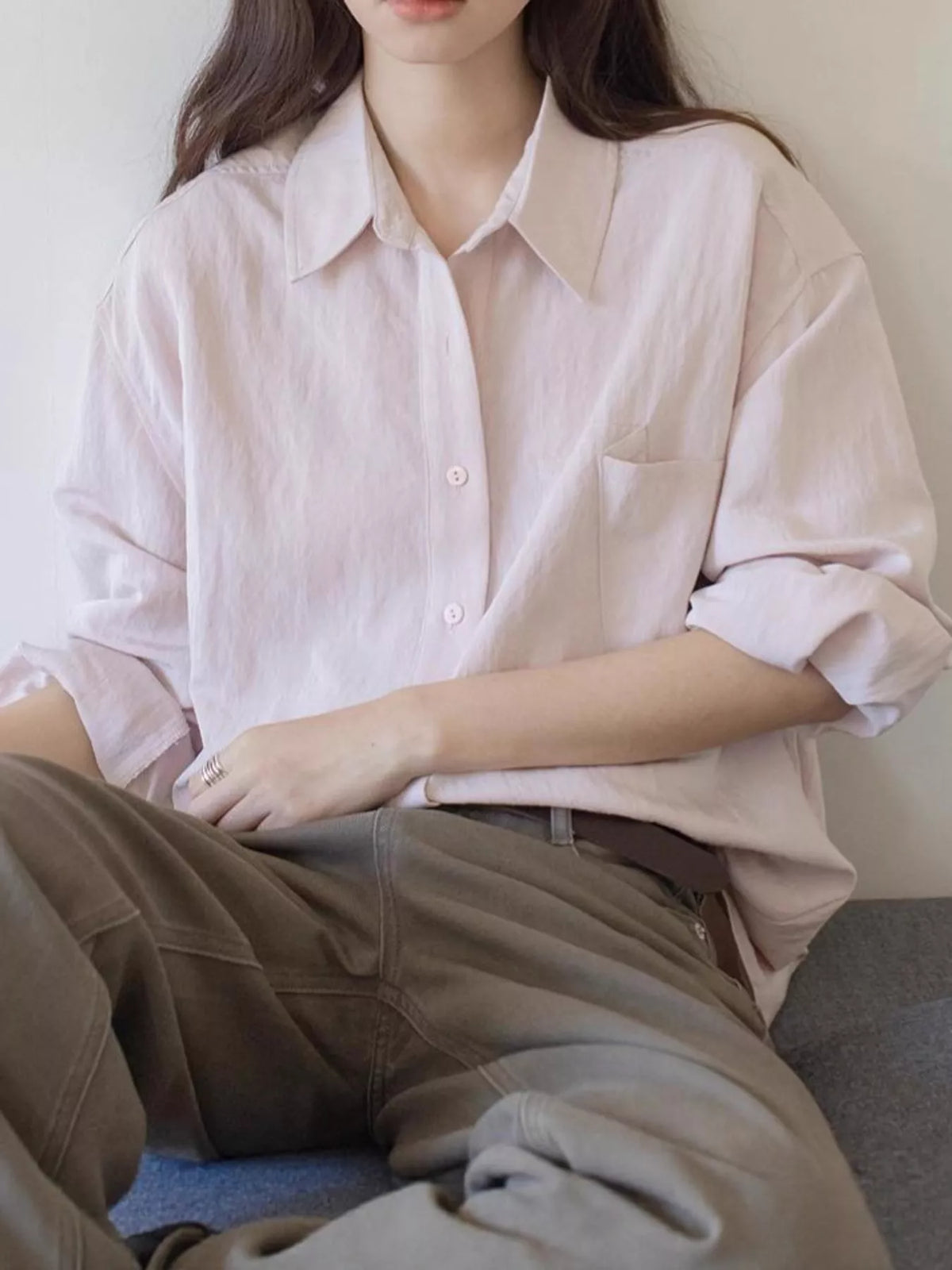 Pink button down long sleeve shirt, front view