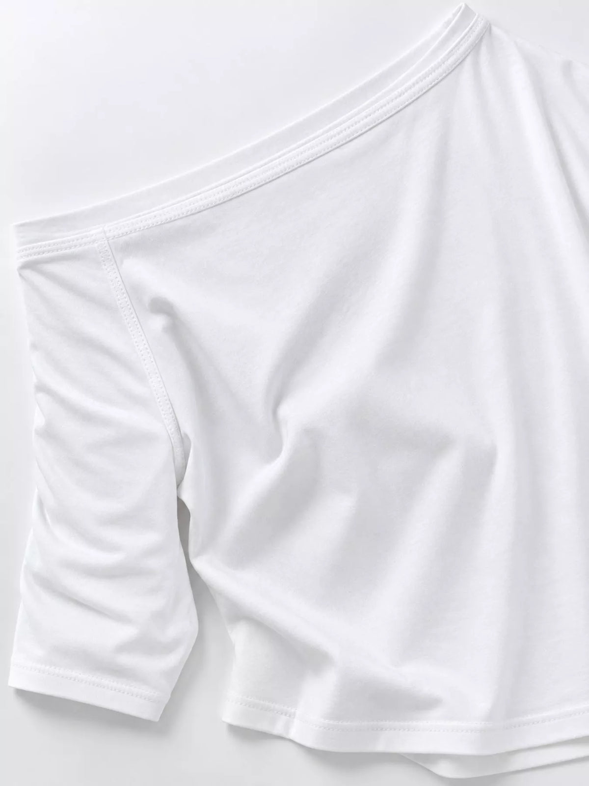 White asymmetric-neck T-shirt, sleeve and hem detail