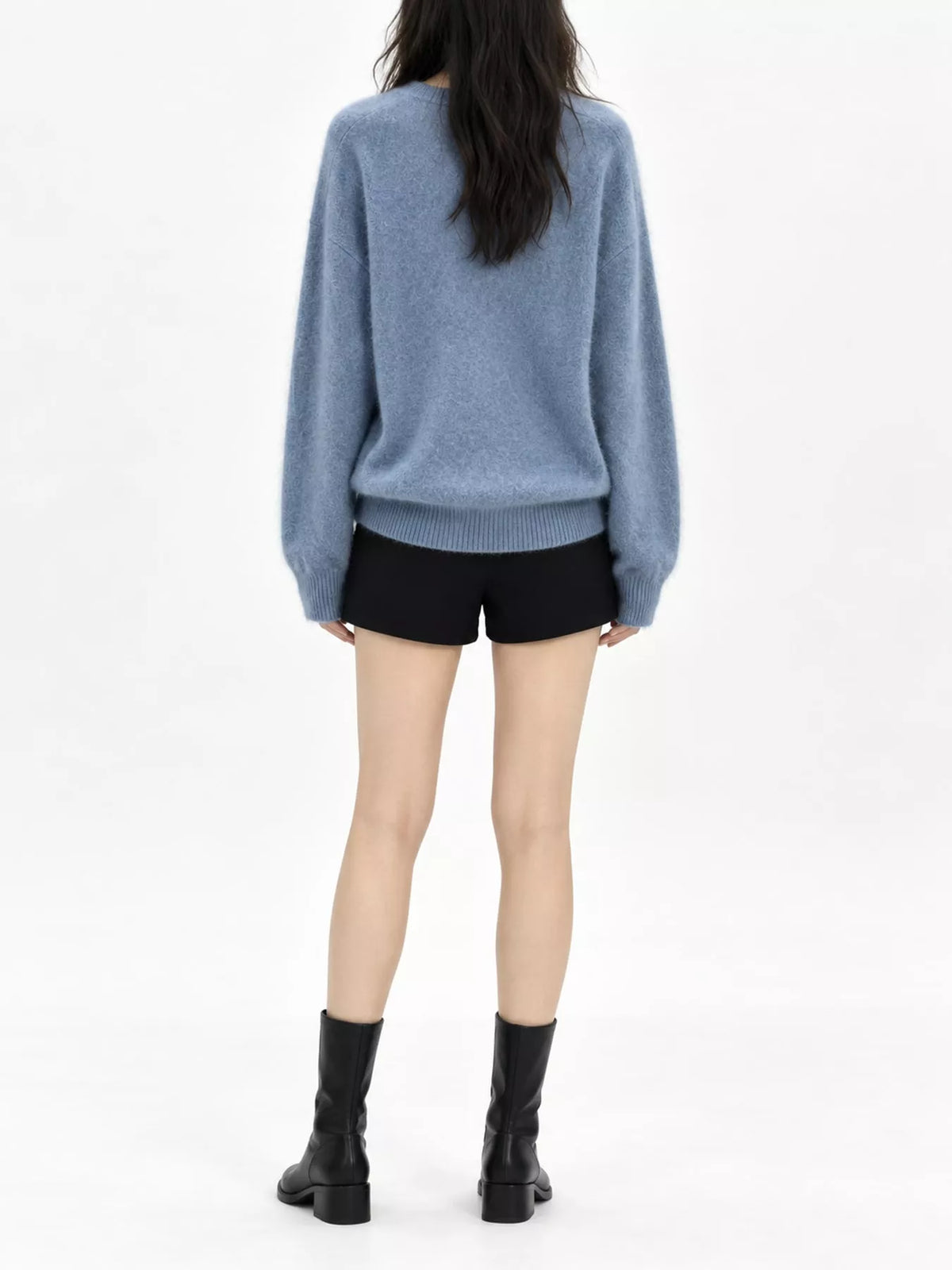 Blue v-neck sweater, back view
