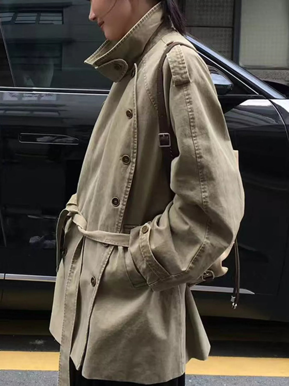 Khaki double-breasted belted cotton trench coat, side view