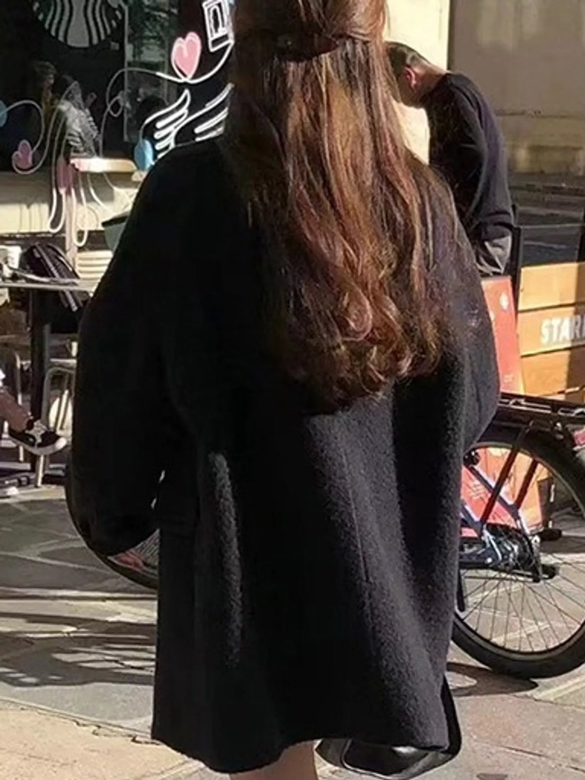 Black double-breasted wool-blend coat — back view