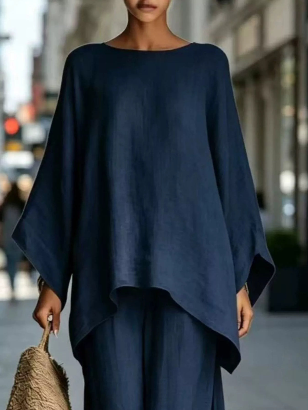 Navy blue batwing top, neckline and hem view