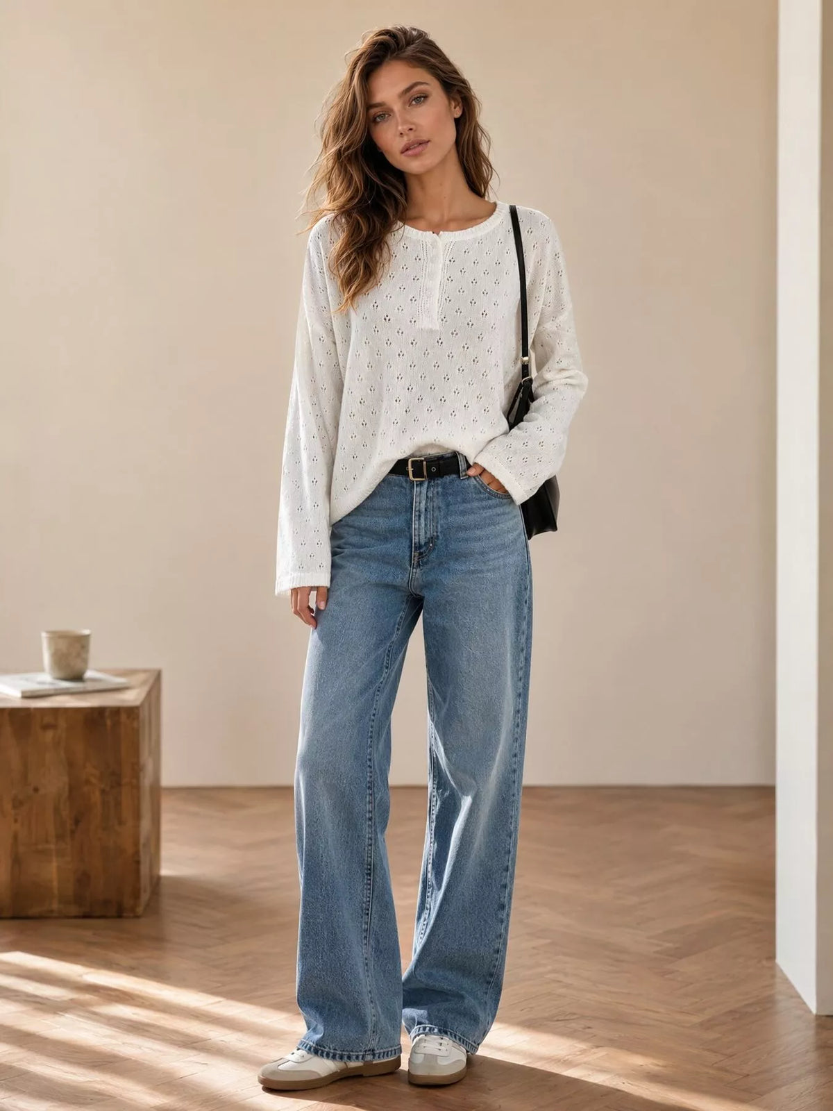 White pointelle round-neck knit top, full-length styled view.