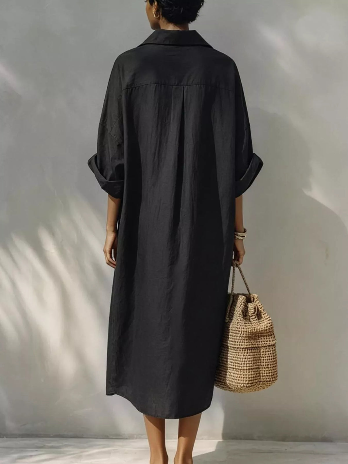 Black button-down shirt dress, back view
