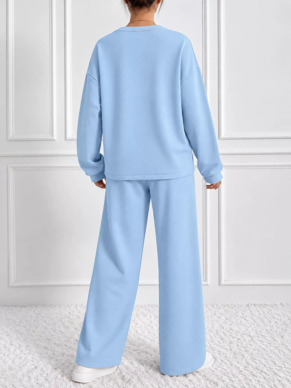Blue oversized sweatshirt and wide-leg pants set — back view